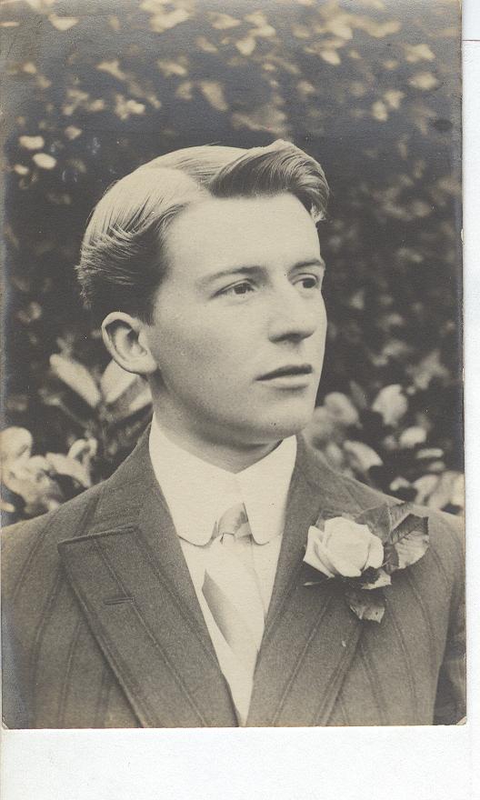 Young Man Wearing a Suit. With A Crosage