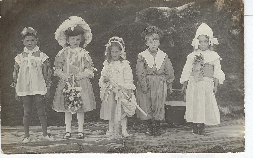 Five Small Children Dressed on stage