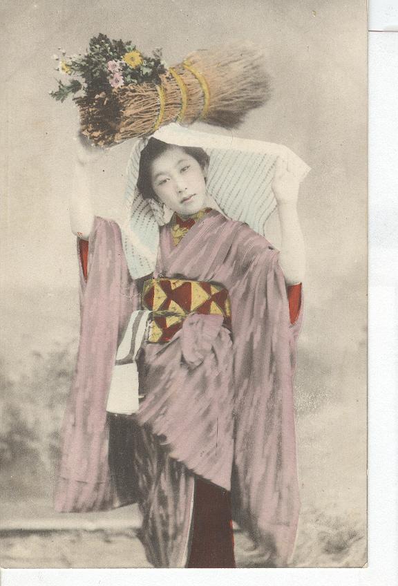 Geisha Girl,Holding Floral Bundle above her Head...Japan